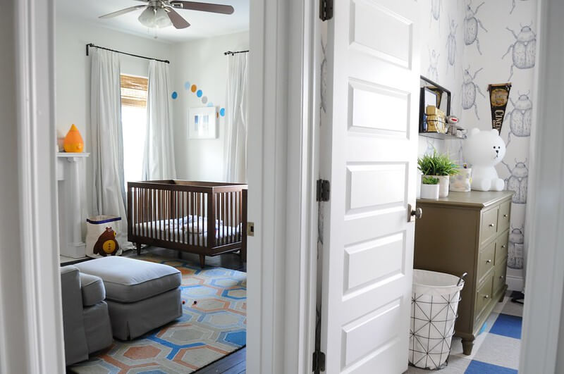 neutral gray and blue nursery with curtains