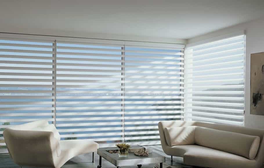Custom blinds on large windows in Aurora living room