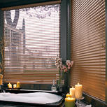 A custom window treatment next to a bathtub