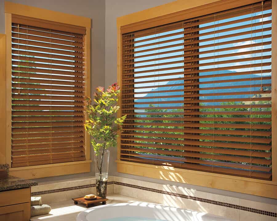 Custom wood window blinds installed in master bathroom