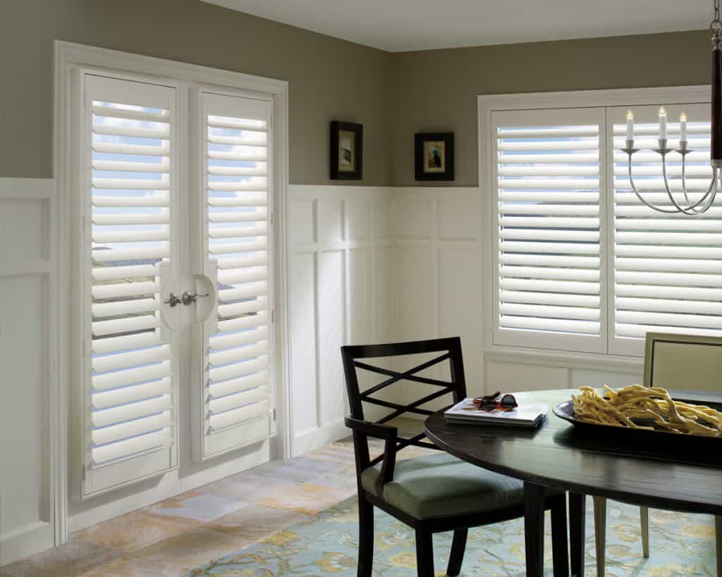 Custom shutters on windows and doors in Bellaire home