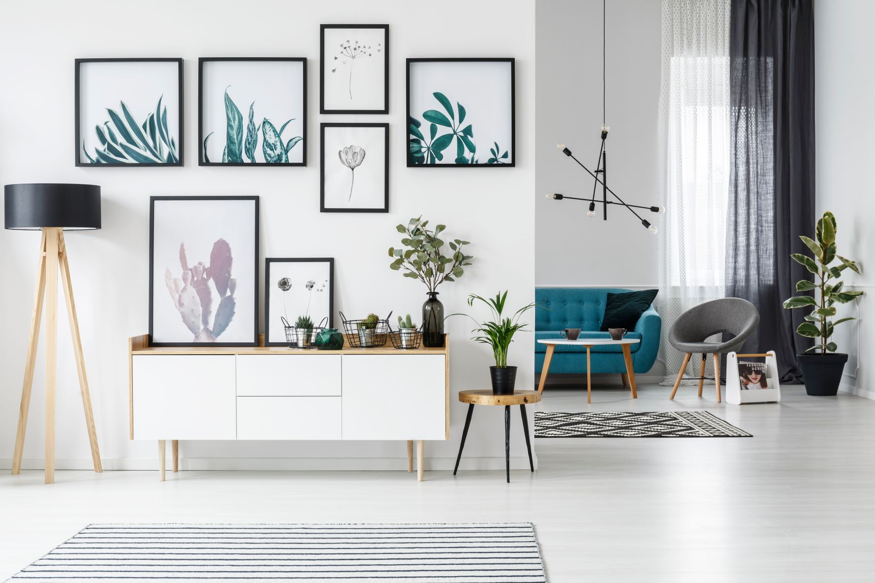 modern decor livingroom with high ceilings and vertical wall art display