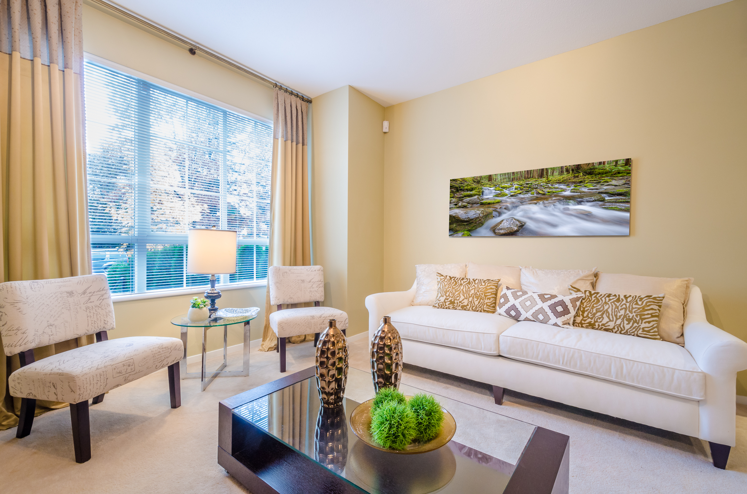 living room with ceiling length curtains